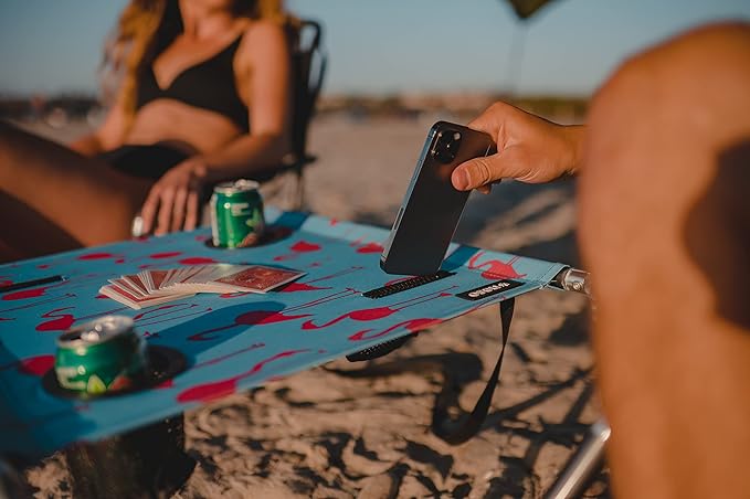Neso Beach Table - Lightweight, Portable and Foldable Table for Beach, Camping and Outdoor Adventures - Stable Surface - with Cup Holder for Drinks and Phone Pockets - Flamingos
