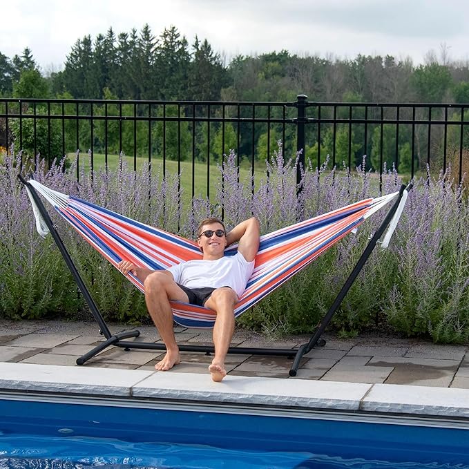 Vivere Double Cotton Hammock with Space Saving Steel Stand, Upgraded Polyester End Strings 450 lb Capacity - Premium Carry Bag Included - USA Grown Cotton (Orange Punch)